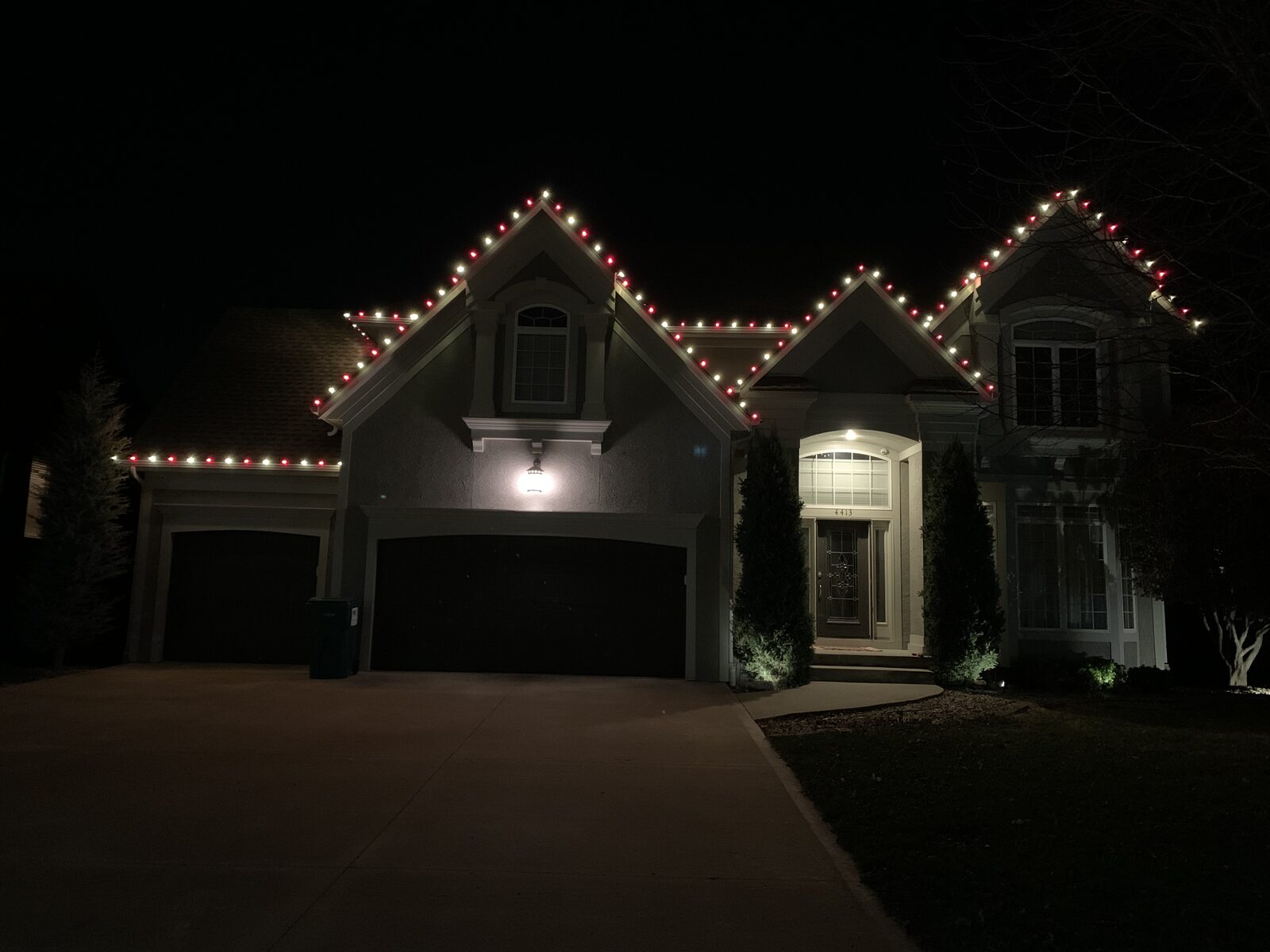 Residential holiday light installation — professional C9 LED display